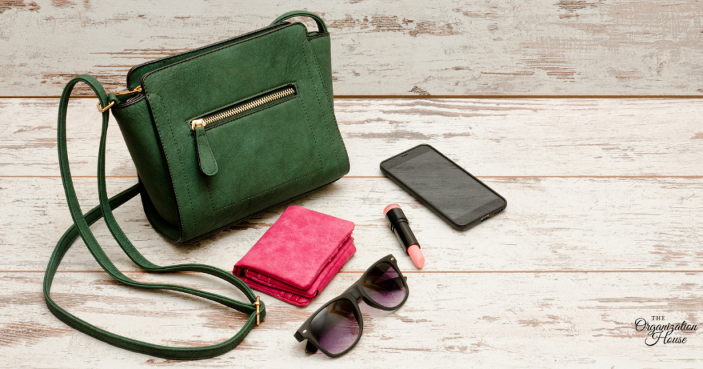 Purse, wallet, phone, lipstick, and sunglasses - things you'd need Purse Storage Ideas for.